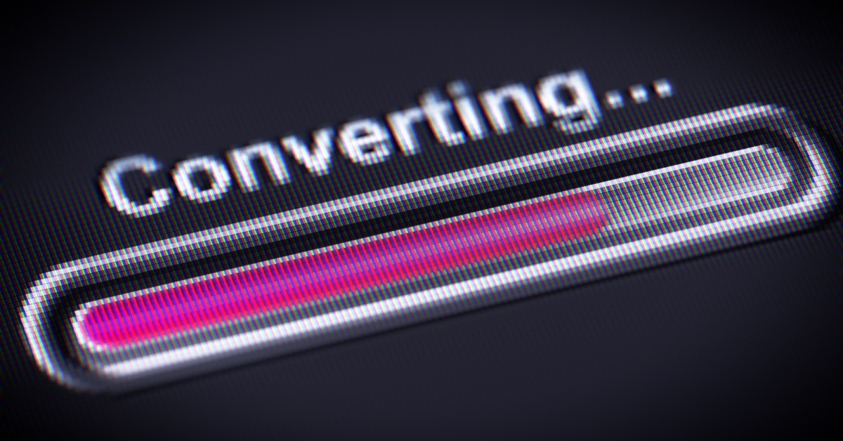 A close up view of a loading bar that says "Converting..." above it. You can see the pixels that make up the bar and letters.