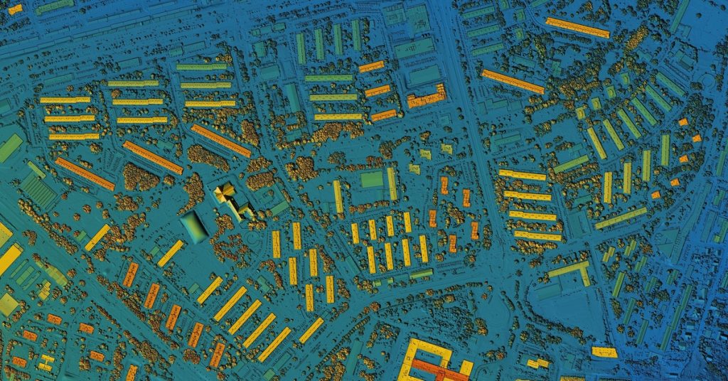 An overhead digital elevation model of an urban area. The ground is blue, but the buildings are either green, yellow, or orange.